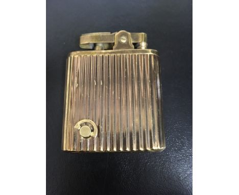 A gold plated musical lighter.