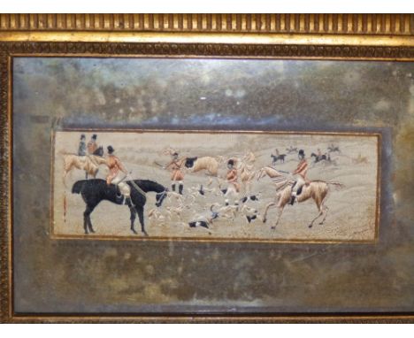 A framed Stevengraph depicting a hunting scene. 2” x 6”.
