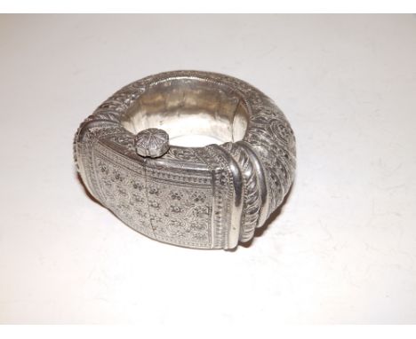A heavy white metal Islamic bangle.