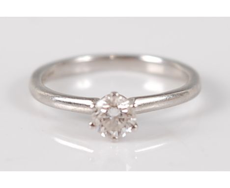 A contemporary platinum diamond solitaire ring, the six claw set brilliant weighing approx 0.33 carats, 3.1g, size K