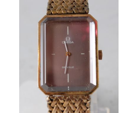 A gents gold plated Omega de Ville manual wind wristwatch, with octagonal brown quarter baton dial, case number 511.447/711.1