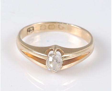 An 18ct yellow gold single stone diamond ring, featuring an old mine cut diamond set within bifurcated shoulders, diamond dim