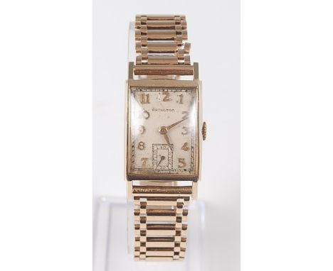 A gentleman's 14ct yellow gold manual wind 19 jewel Hamilton wristwatch, the rectangular cream Arabic dial with subsidiary di