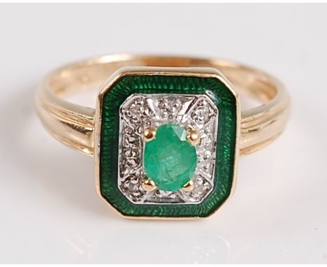 A 14ct yellow gold, emerald and diamond octagonal cluster ring, the oval emerald measuring approx 4.7 x 3.5 x 2.61mm, weight 