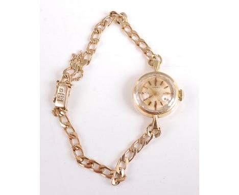 A 14ct yellow gold lady's manual wind wristwatch, having discoloured round champagne baton dial, diamond cut edge to glass an