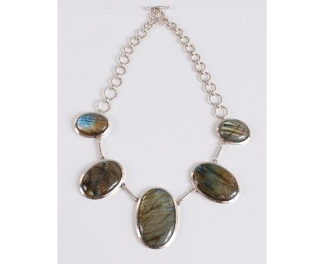 A sterling silver labradorite necklet, the 5 graduated oval cabochon cut labradorites measuring between 27x22mm and 47x32mm, 