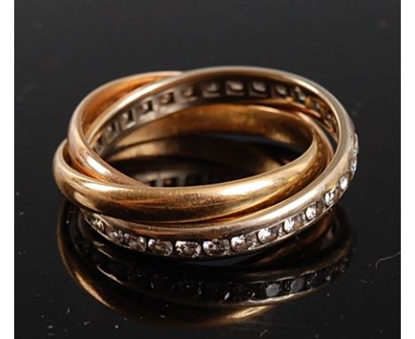 A yellow, white and rose metal Russian wedding ring , the white band channel set with 32 round brilliant cut diamonds, diamon