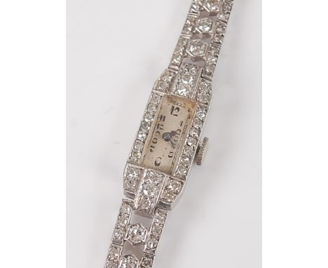 A 9ct white gold 15 jewel manual wind diamond cocktail wristwatch, with champagne Arabic dial, the octagonal case and bracele