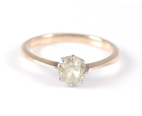 A yellow metal single stone diamond ring, the ring having an old mine cut fancy light yellow diamond in an eight claw setting