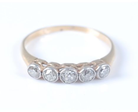 A yellow and white metal five stone diamond half hoop eternity ring, the five graduated old European cut diamonds in millegra