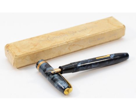 Conway Stewart, a blue mottled lever action fountain pen with 14ct gold nib, box and original guarantee.