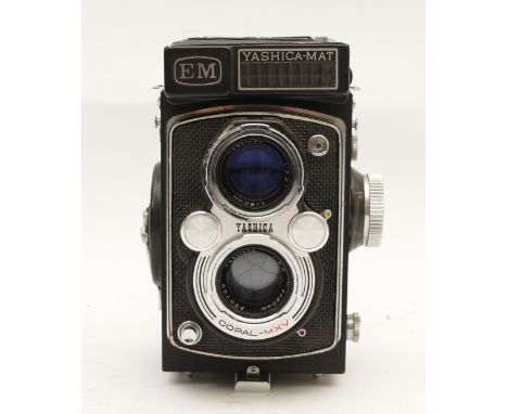 A Yashica-Mat EM TLR camera, with Yashinon f/3.2 80mm and Yashinon f/3.5 80mm lenses, in case.