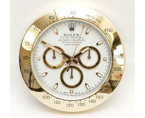 A decorative Rolex Daytona Cosmograph style dealer's wall clock, the turquoise dial set with subsidiary seconds and inscribed