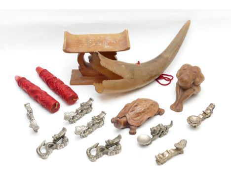 A collection of East Asian ornaments, to include, Price's Dragon Candles, in box, a carved wooden neck rest, and a selection 