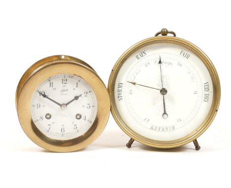 A Shatz bulkhead clock, stamped Ships Bell, seven jewels, with an eight day movement, 11cm diameter, together with an early t