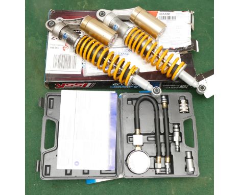 A Silverline petrol engine compression testing kit, also a pair of YSS Eco-line gas shock absorbers.