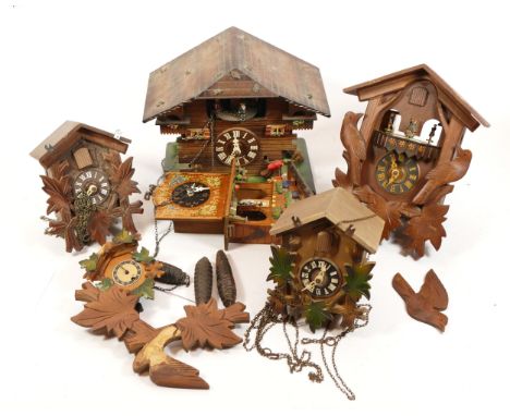A collection of five mid-twentieth century Black Forest cuckoo clocks, having single and twin train manual wind movement. (1)