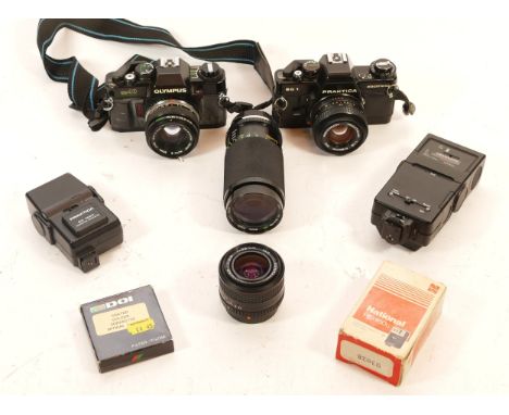 A Praktica BC1 35mm camera, having additional lenses, flash light, and carry case, together with an Olympus OM40 SLR 35mm cam