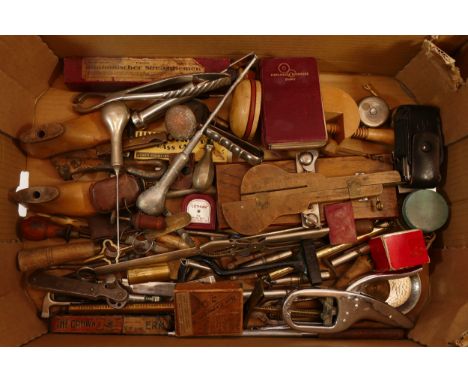 A collection of tools and other items including Arnold And Sons surgeons instruments, early Leatherman multi tool and bulls h