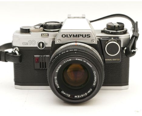 An Olympus OM10 film camera with an Olympus Zuiko f/1.8 50mm lens.