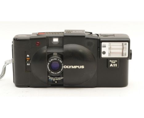 An Olympus XA2 compact film camera, in original fitted case with instructions.