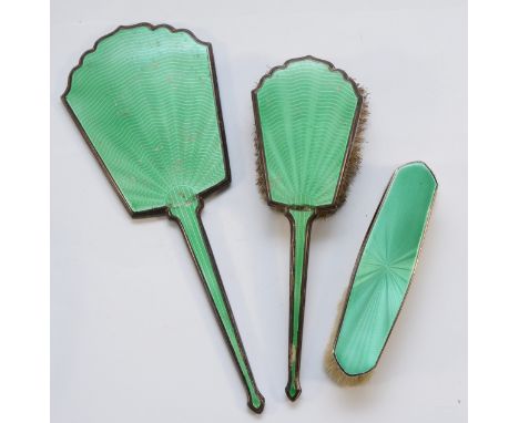 A silver and green guilloche enamel dressing table hair brush, unmarked, hand mirror, unmarked and clothes brush, Birmingham 