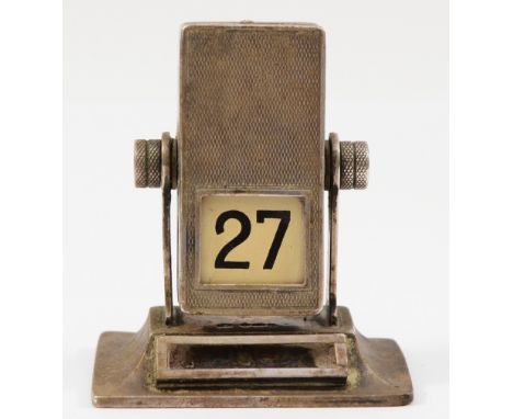 A 925 silver manual rotating desk calendar, London import 1930, lacking the month panel,6.6cm tall.