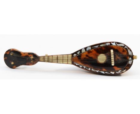 A 19th century miniature tortoiseshell mandolin, with mother of pearl detail, 13.5cm