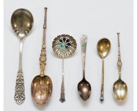 A pre Revolution Russian silver gilt and enamel lemon tea spoon, 9.5cm, two silver gilt anointing spoons and three other spoo