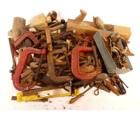 A collection of early 20th century and later carpenters hand tools, to include a Stanley No.55 plane, mallets, hammers, spiri