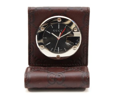 Gucci, a stainless steel travelling alarm clock, model 200, leather case, working order and original sticker on the back case