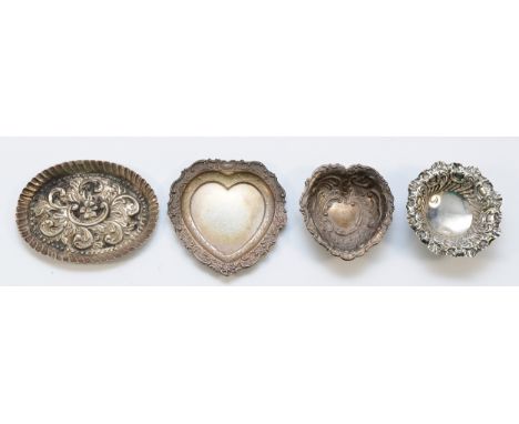 A silver heart shape pin tray, Birmingham 1997 and three other silver trinket dishes, (4), 82gm