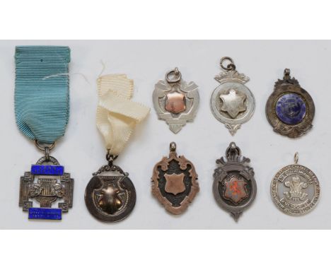 A silver and enamel Long Service, The National Operatic and Drama Association medal and 7 other silver fobs, various dates, 6