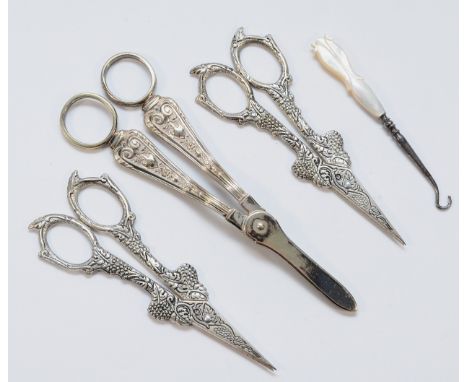 A pair of EPNS grape scissors, two grape and vine scissors and a mother of pearl button hook (4)