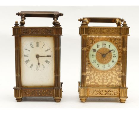Two early twentieth century brass carriage clocks, having enamelled dials with Roman numerals, housing 8 day movements, and c