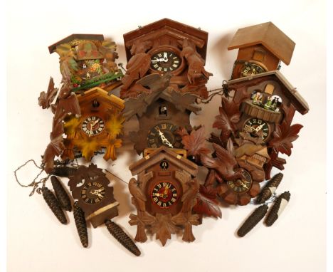 A collection of mid-twentieth century Black Forest cuckoo clocks, having single and twin train manual wind movement, suitable