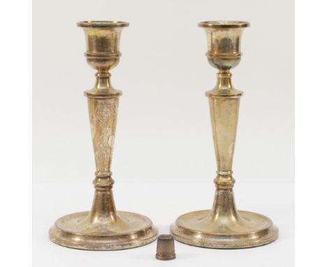 A silver pair of fluted candlesticks, Birmingham 1981, 19.8cm, loaded, together with a Henry Griffith and Son 'The Spa' sterl