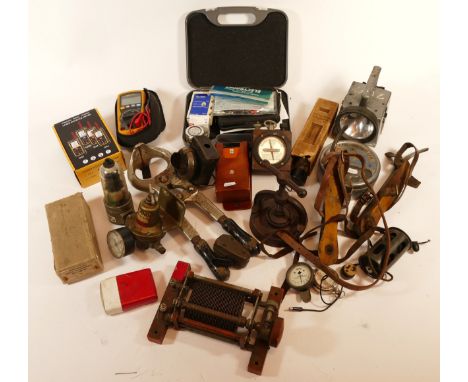 A collection of vintage and modern electrical test equipment, plus; vintage torches, veterinarian castration tool, ice skates