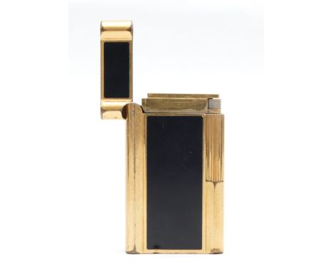 A Rothschild pocket gas cigarette lighter, gold plated with black enamelled panels, boxed with outer sleeve and instructions.