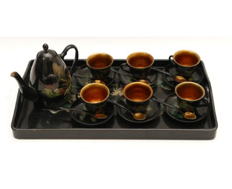 A Chinese lacquered coffee set, comprising tray, six cups, six saucers, six spoons and coffee pot, having black ground with m