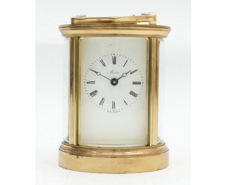 A mid to late twentieth century Mistas brass carriage clock, in the form of a cylinder, having an enamelled dial with Roman n