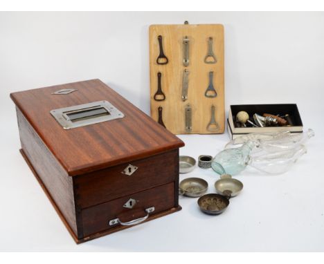 An early 20th century wooden shop counter cash till, together with a selection of collectables, including corkscrews, bottle 