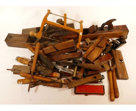A box of carpenters tools to include chisels, gouges and a Marples bow saw.