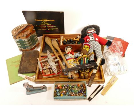 A Robertsons Merchandise plush doll, together with a wooden chess board, juggling batons, an accordion, a cased pool cue, sta