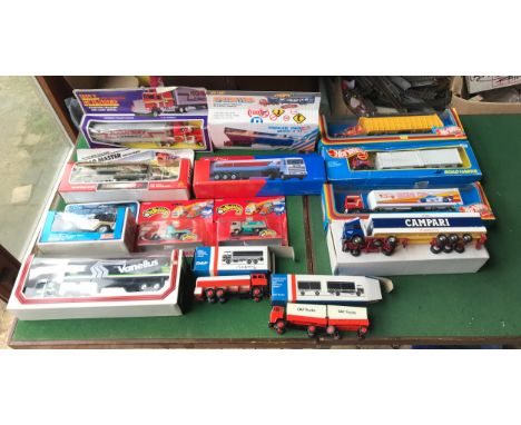 Collection of diecast metal and plastic model trucks, Hot Wheels, Dumper Truck, Road Hawks truck, Racing Team Truck, Campari 