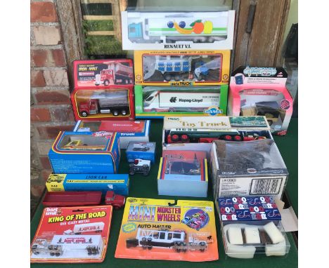 Selection of boxed diecast and plastic truck models, various makes including Hess Gasoline Truck, Kenworth, Iron Mike, Gama, 