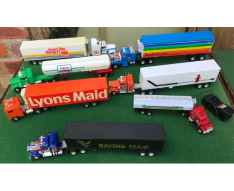 Seven plastic truck with trailers made in Hong Kong.Condition ReportGood condition, light playwear.