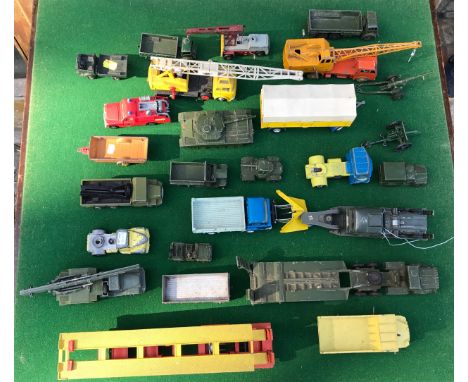 A collection of Dinky Diecast vehicles to include 965 Rear Dump Truck, 674 Austin Champ, 641 Army 1 Ton Truck, 670 Armoured C