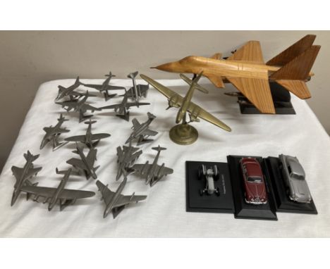 A large collection of planes and cars to include mostly Royal Hampshire cast pewter, Hurricane, Hawk, Canberra, Wellington, T