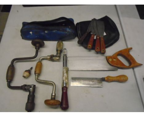 various tools to include saws, brass plumbline, drill braces and bits, paint scrapers etc